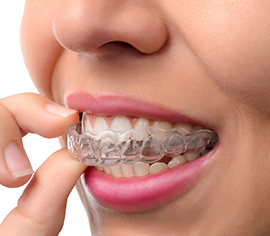 woman wearing orthodontic silicone trainer