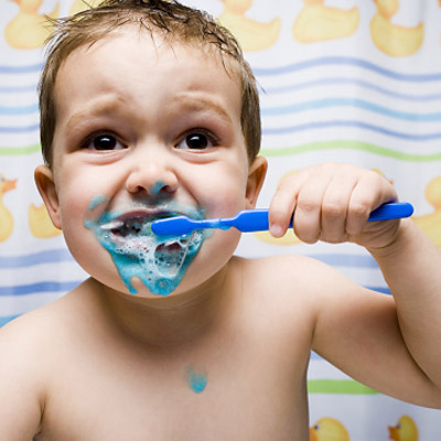 kid dentist brushing teeth